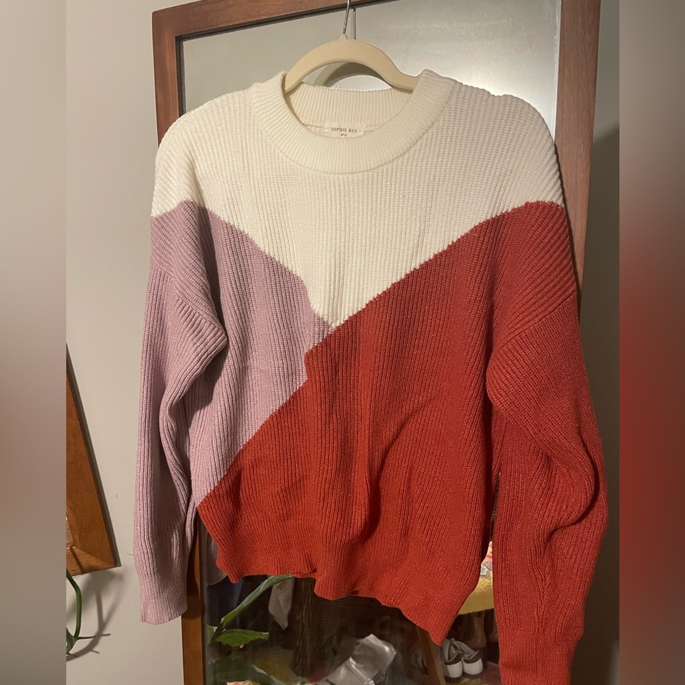 Orange, purple, and cream crew neck sweater